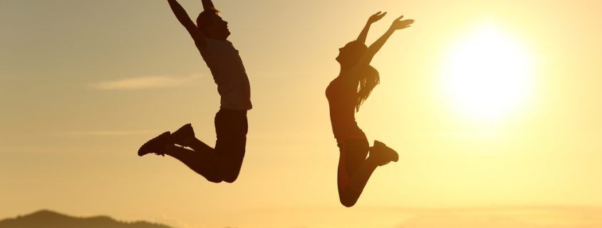 man and woman jumping